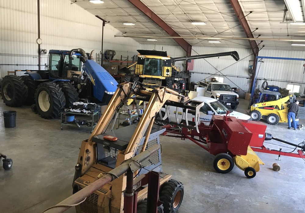 Peabudy's service department working on farm equipment